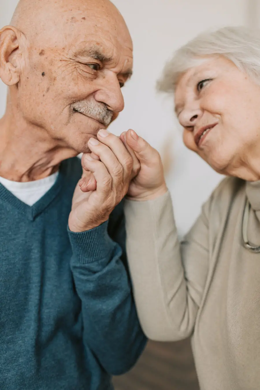Older couple holding hands